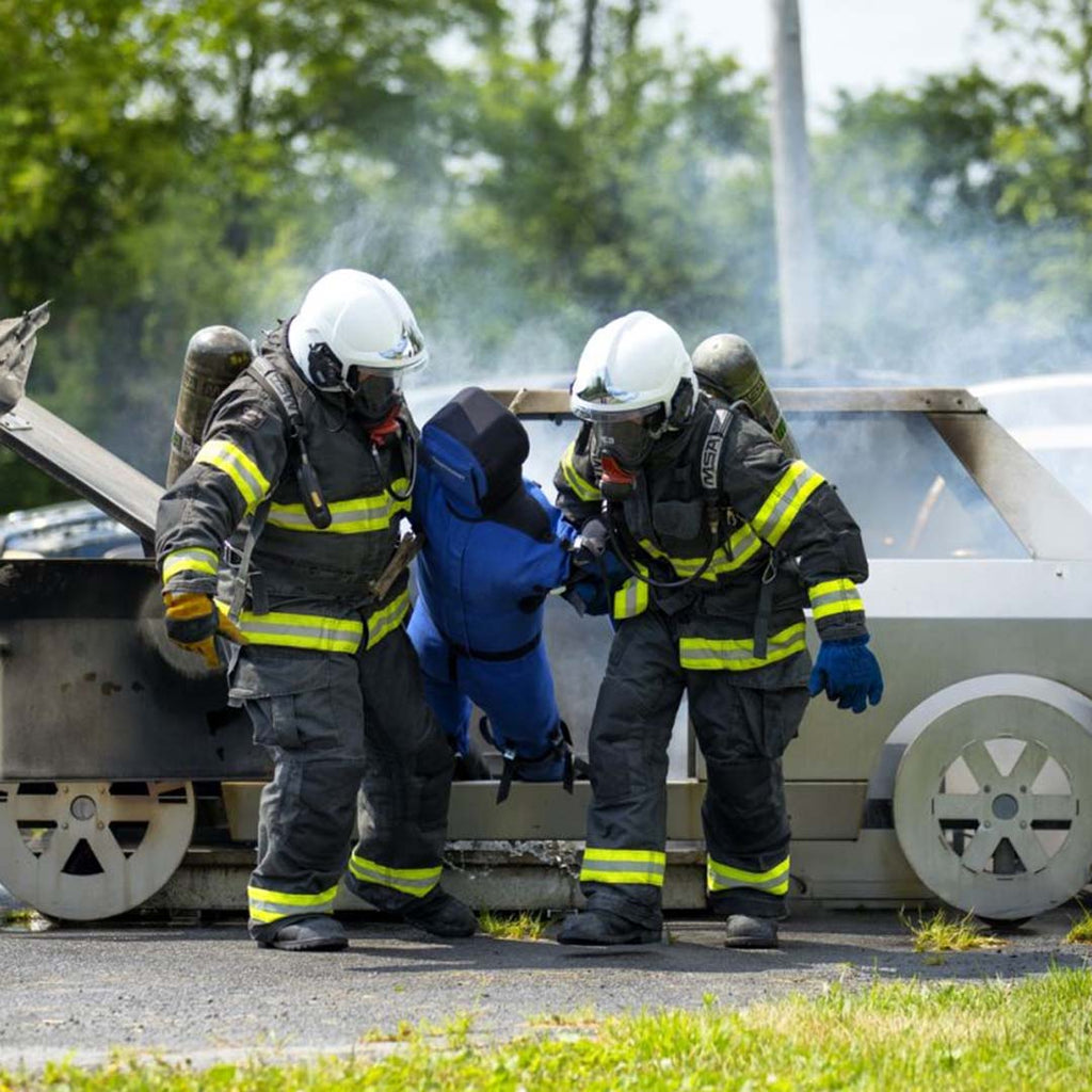 LION® SmartDummy™ Extrication being dragged out of a vehicle by fire fighters