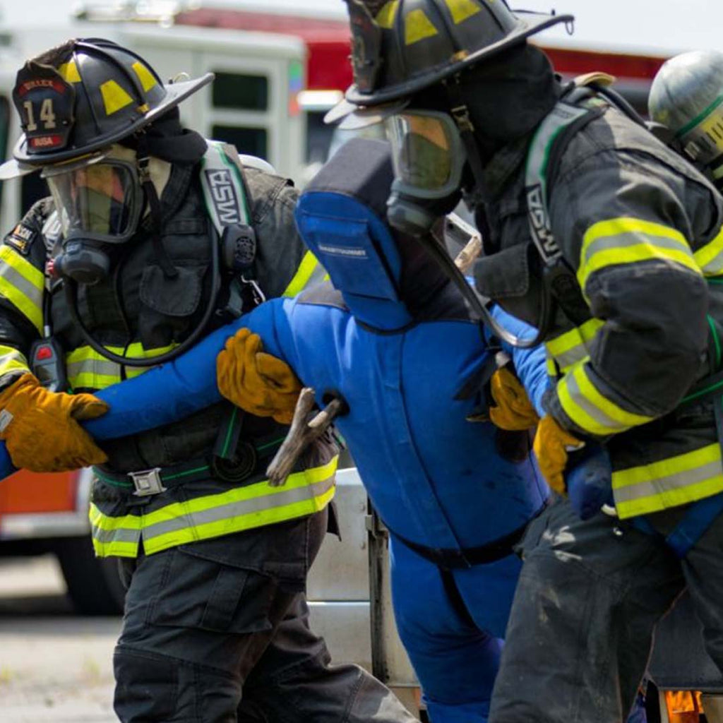 LION® SmartDummy™ Extrication being dragged by fire fighters