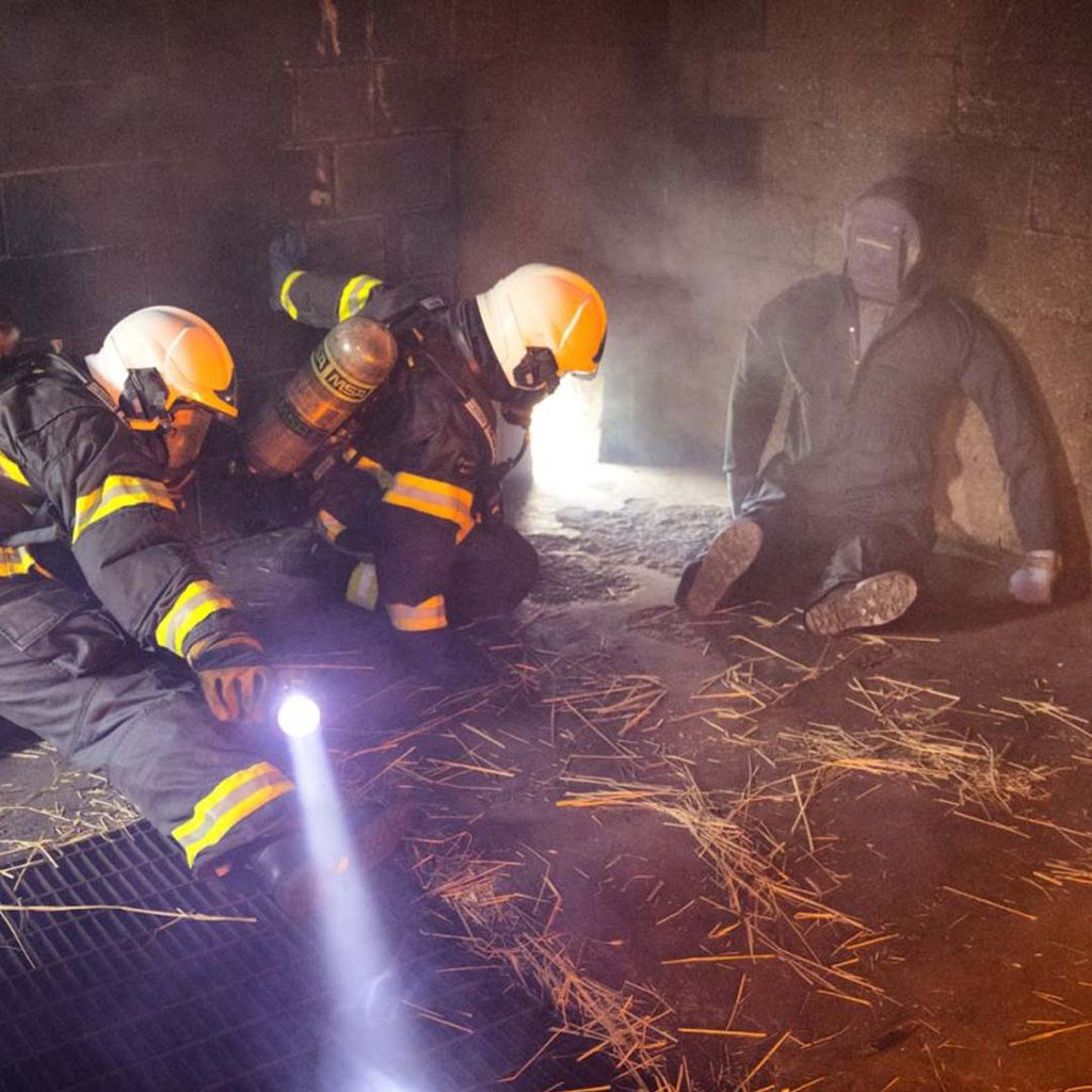 Fire fighters rescuing the LION® SmartDummy™ Rescue