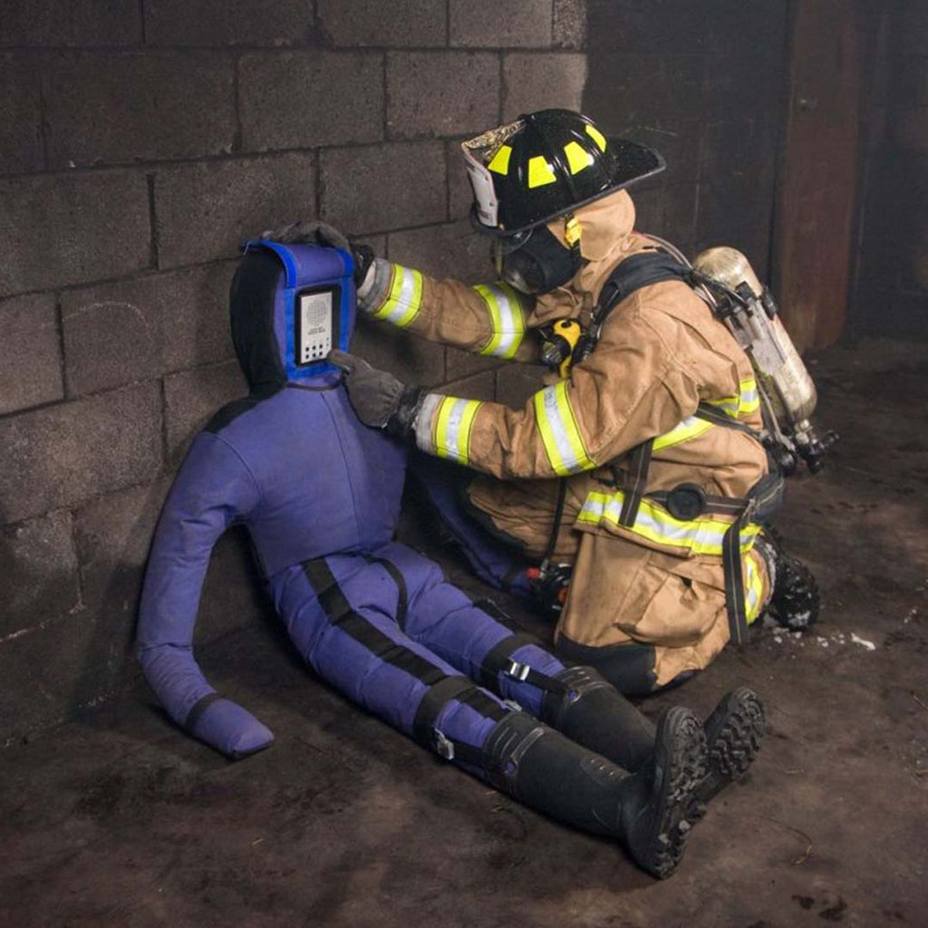 fire fighter adjusting the voicebox on the LION® SmartDummy™ Rescue